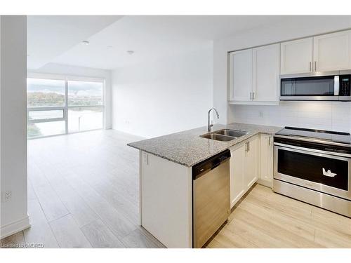 509-1050 Main Street East, Milton, ON - Indoor Photo Showing Kitchen With Stainless Steel Kitchen With Double Sink