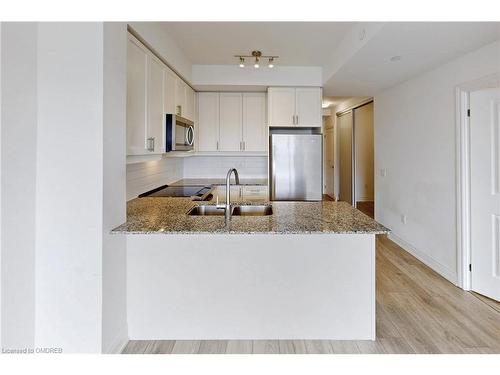 509-1050 Main Street East, Milton, ON - Indoor Photo Showing Kitchen With Double Sink