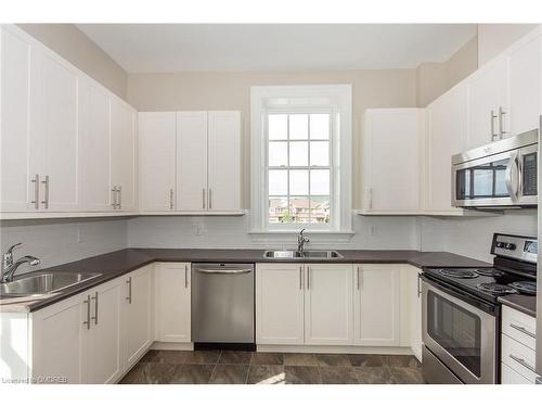 422-33 Whitmer Street, Milton, ON - Indoor Photo Showing Kitchen With Stainless Steel Kitchen With Double Sink