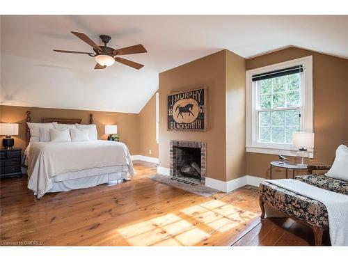 8268 Canyon Road, Campbellville, ON - Indoor Photo Showing Bedroom With Fireplace