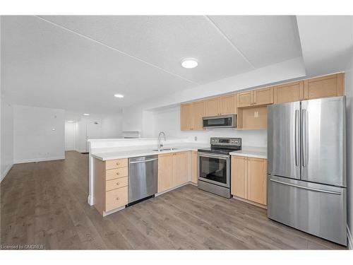 311-1470 Bishops Gate, Oakville, ON - Indoor Photo Showing Kitchen With Stainless Steel Kitchen With Double Sink