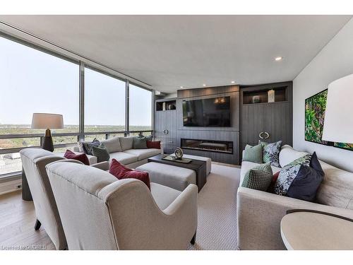 Ph2-2170 Marine Drive, Oakville, ON - Indoor Photo Showing Living Room With Fireplace