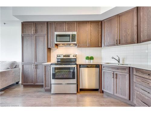 303-560 North Service Road, Grimsby, ON - Indoor Photo Showing Kitchen With Stainless Steel Kitchen With Double Sink