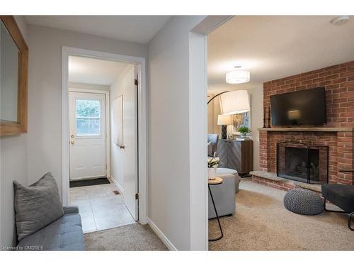 586 Hayward Crescent, Milton, ON - Indoor Photo Showing Living Room With Fireplace