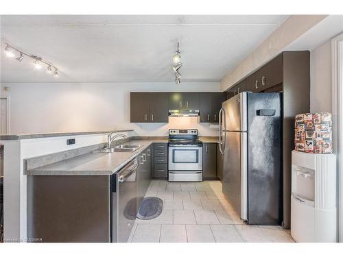 102-1810 Walker'S Line, Burlington, ON - Indoor Photo Showing Kitchen With Double Sink