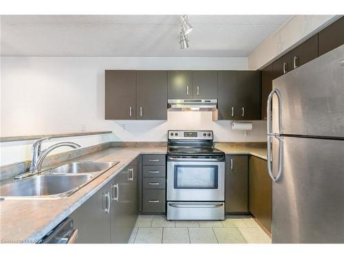 102-1810 Walker'S Line, Burlington, ON - Indoor Photo Showing Kitchen With Stainless Steel Kitchen With Double Sink