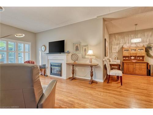 316-2085 Amherst Heights Drive, Burlington, ON - Indoor Photo Showing Living Room With Fireplace