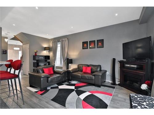 90 Palacebeach Trail, Stoney Creek, ON - Indoor Photo Showing Living Room With Fireplace