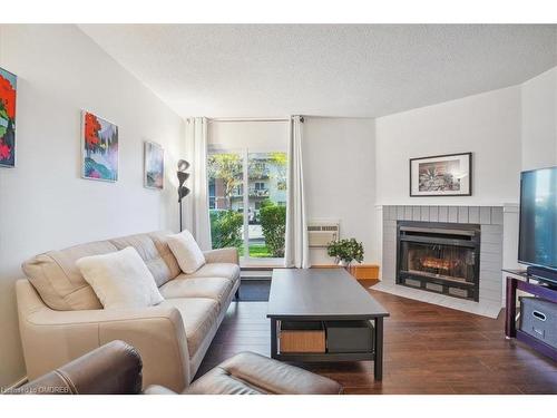 312-1450 Glen Abbey Gate, Oakville, ON - Indoor Photo Showing Living Room With Fireplace