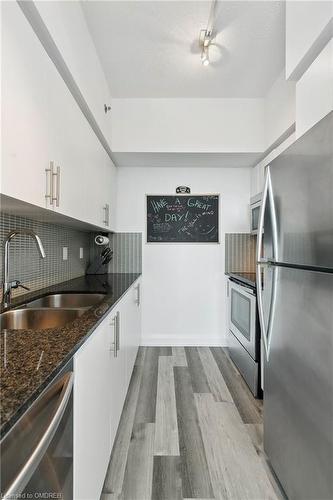 705-65 Speers Road, Oakville, ON - Indoor Photo Showing Kitchen With Stainless Steel Kitchen With Double Sink