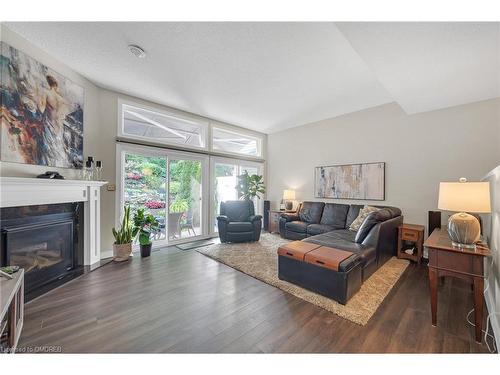 8-177 Main Street W, Grimsby, ON - Indoor Photo Showing Living Room With Fireplace