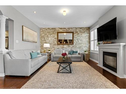 358 Malboeuf Court, Milton, ON - Indoor Photo Showing Living Room With Fireplace