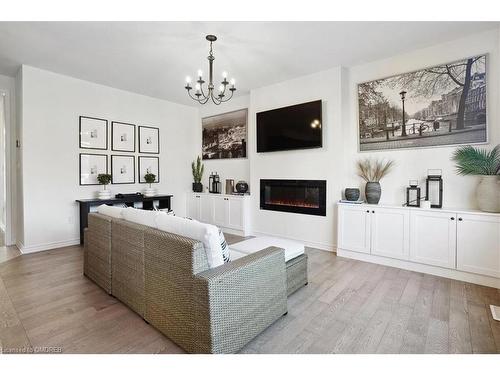 1429 Sycamore Garden, Milton, ON - Indoor Photo Showing Living Room With Fireplace