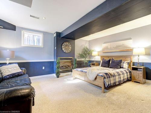 36 Kildonan Crescent, Waterdown, ON - Indoor Photo Showing Bedroom With Fireplace