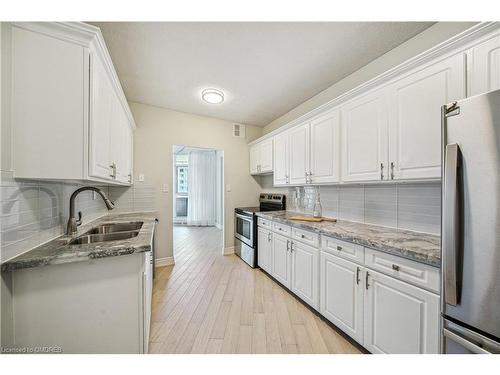 708-5250 Lakeshore Road, Burlington, ON - Indoor Photo Showing Kitchen With Double Sink With Upgraded Kitchen