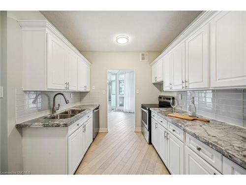 708-5250 Lakeshore Road, Burlington, ON - Indoor Photo Showing Kitchen With Double Sink