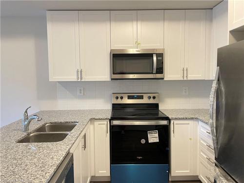 107-1565 Rose Way, Milton, ON - Indoor Photo Showing Kitchen With Stainless Steel Kitchen With Double Sink With Upgraded Kitchen