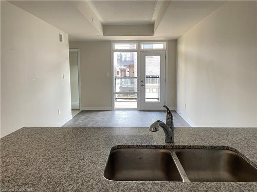 107-1565 Rose Way, Milton, ON - Indoor Photo Showing Kitchen With Double Sink