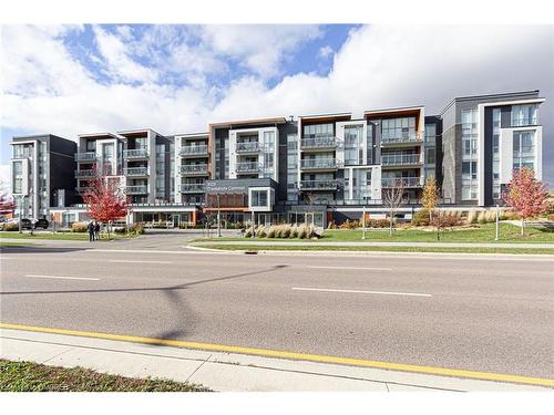 304-3028 Creekshore Common, Oakville, ON - Outdoor With Balcony With Facade