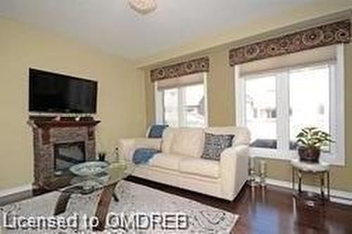 4799 Thomas Alton Boulevard, Burlington, ON - Indoor Photo Showing Living Room With Fireplace