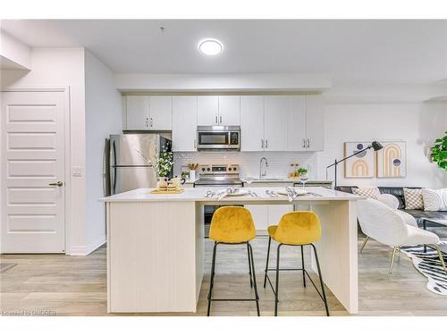 223-1105 Leger Way, Milton, ON - Indoor Photo Showing Kitchen With Stainless Steel Kitchen With Double Sink