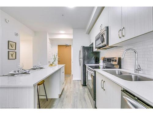 223-1105 Leger Way, Milton, ON - Indoor Photo Showing Kitchen With Stainless Steel Kitchen With Double Sink With Upgraded Kitchen