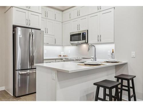 629-128 Grovewood Common, Oakville, ON - Indoor Photo Showing Kitchen With Stainless Steel Kitchen With Upgraded Kitchen