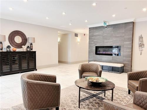 210-257 Millen Road, Stoney Creek, ON - Indoor Photo Showing Living Room With Fireplace