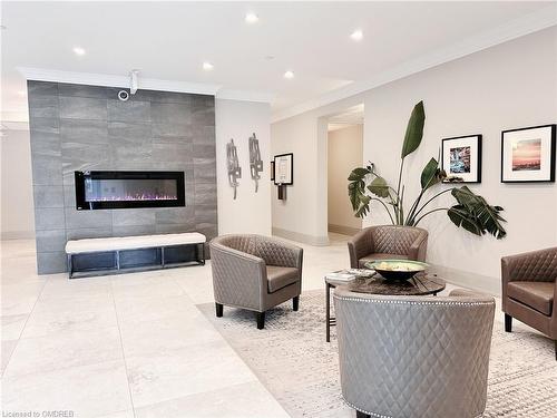 210-257 Millen Road, Stoney Creek, ON - Indoor Photo Showing Living Room With Fireplace