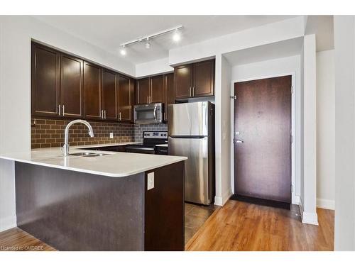 523-2480 Prince Michael Drive, Oakville, ON - Indoor Photo Showing Kitchen With Stainless Steel Kitchen