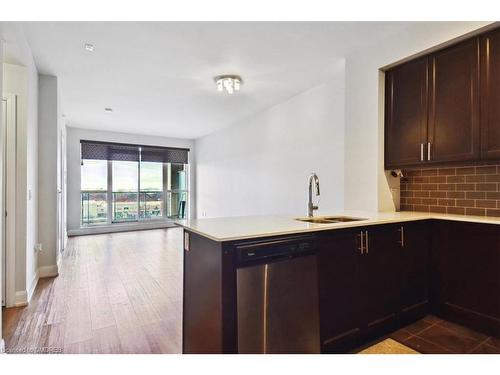 523-2480 Prince Michael Drive, Oakville, ON - Indoor Photo Showing Kitchen With Double Sink