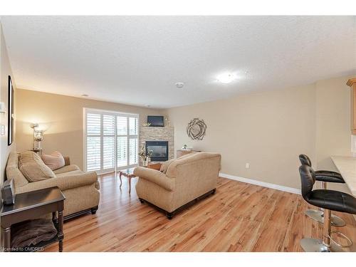 406-12 St Andrews Street, Port Dover, ON - Indoor Photo Showing Living Room With Fireplace