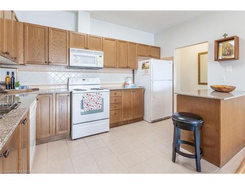 403-1499 Nottinghill Gate, Oakville, ON - Indoor Photo Showing Kitchen With Double Sink