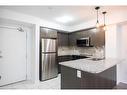 111-1045 Nadalin Heights, Milton, ON  - Indoor Photo Showing Kitchen With Double Sink With Upgraded Kitchen 