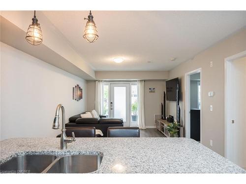 111-1045 Nadalin Heights, Milton, ON - Indoor Photo Showing Kitchen With Double Sink