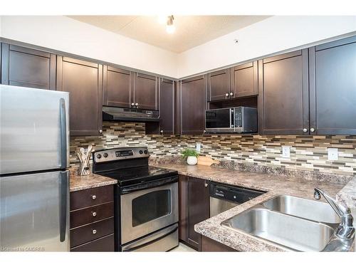 208-1340 Main Street E, Milton, ON - Indoor Photo Showing Kitchen With Double Sink