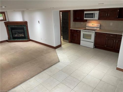 Lower Lvl-132 Elmwood Road, Oakville, ON - Indoor Photo Showing Kitchen With Fireplace