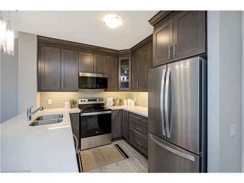 119-830 Megson Terrace, Milton, ON - Indoor Photo Showing Kitchen With Double Sink