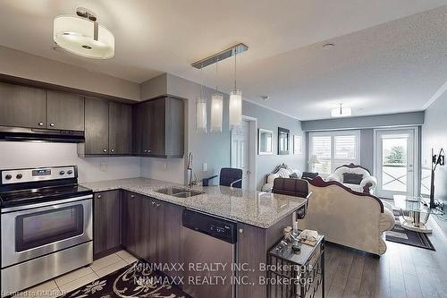 305-1005 Nadalin Heights, Halton, ON - Indoor Photo Showing Kitchen With Stainless Steel Kitchen With Double Sink