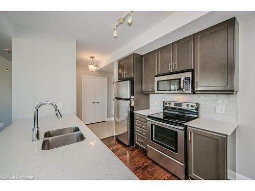 504-2470 Prince Michael Drive, Oakville, ON - Indoor Photo Showing Kitchen With Stainless Steel Kitchen With Double Sink With Upgraded Kitchen