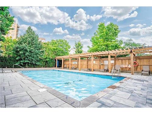 611-2365 Central Park Drive, Oakville, ON - Outdoor With In Ground Pool With Deck Patio Veranda