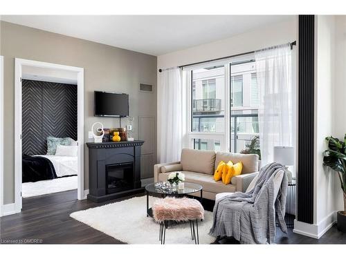 720-2450 Old Bronte Road, Oakville, ON - Indoor Photo Showing Living Room With Fireplace