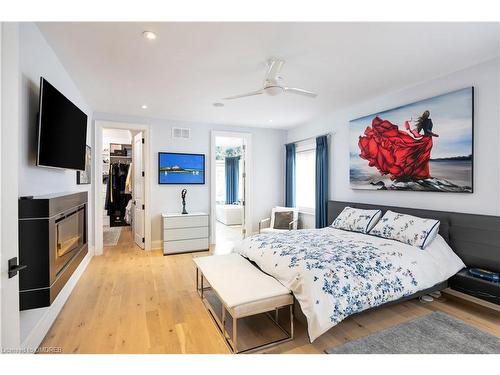 212 Pine Cove Road, Burlington, ON - Indoor Photo Showing Bedroom With Fireplace