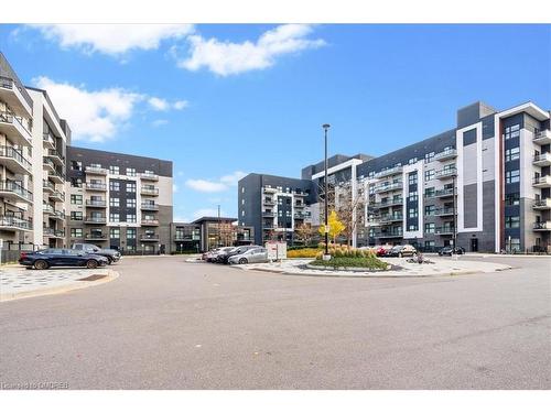 535-102 Grovewood Common, Oakville, ON - Outdoor With Balcony With Facade