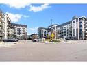 535-102 Grovewood Common, Oakville, ON  - Outdoor With Balcony With Facade 