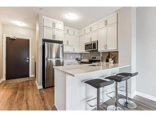 535-102 Grovewood Common, Oakville, ON - Indoor Photo Showing Kitchen With Stainless Steel Kitchen With Upgraded Kitchen