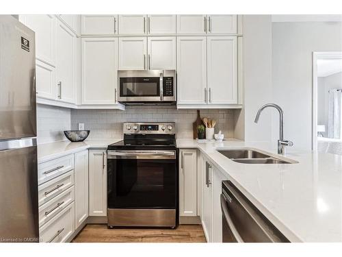 535-102 Grovewood Common, Oakville, ON - Indoor Photo Showing Kitchen With Stainless Steel Kitchen With Double Sink With Upgraded Kitchen