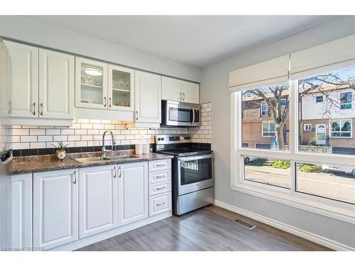 12-1301 Upper Gage Avenue, Hamilton, ON - Indoor Photo Showing Kitchen With Double Sink