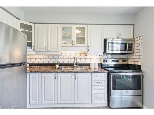 12-1301 Upper Gage Avenue, Hamilton, ON - Indoor Photo Showing Kitchen With Double Sink