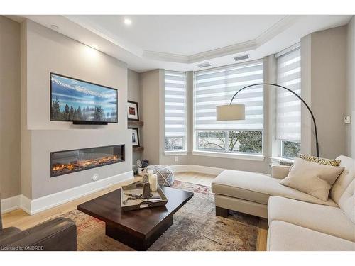 310-1441 Elgin Street, Burlington, ON - Indoor Photo Showing Living Room With Fireplace